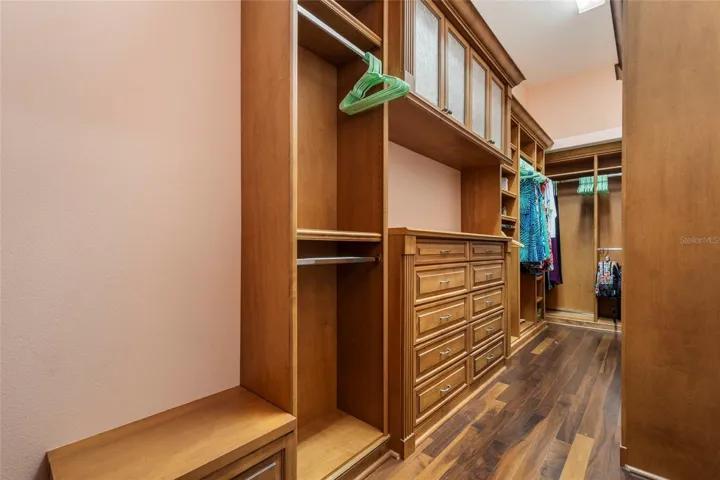So much storage in this master closet. Quality wood for the built in's.