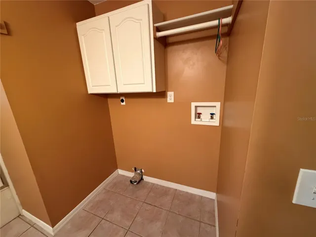 Main Bath with Tile Flooring, Tub/Shower Combo, Laundry