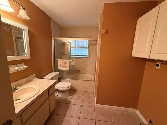 Main Bath with Tile Flooring, Tub/Shower Combo, Laundry
