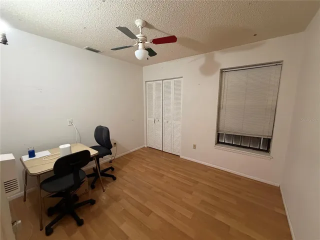 Bedroom with Laminate Flooring and Ceiling Fan