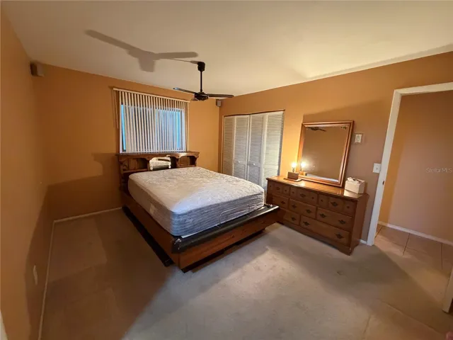 Primary Bedroom with En Suite Bath to Exterior, Dual Closets, Ceiling Fan