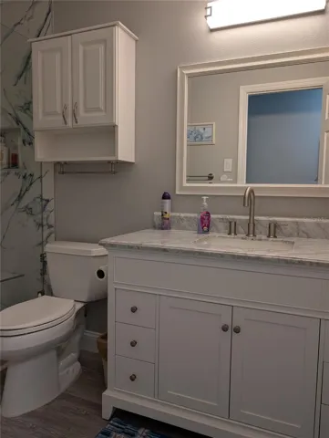 Other updates include luxury vinyl flooring, medicine chest, vanity with marble sinktop, mirror and light.