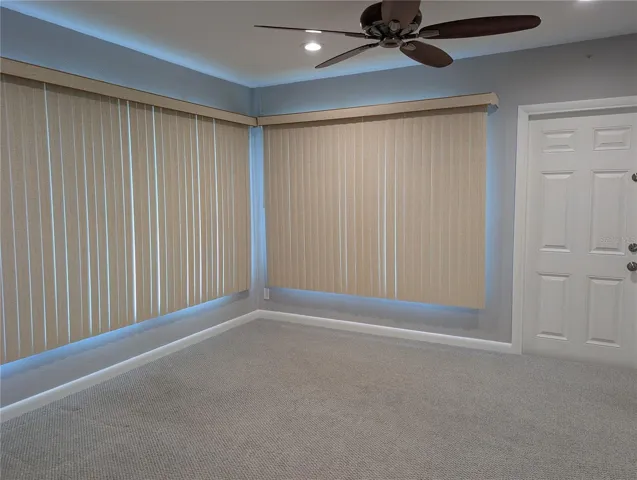 Vacant bonus room. View of interior 6 panel door to side yard.