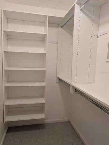 Walk-in, like the Master closet, is also designed like a California style closet.