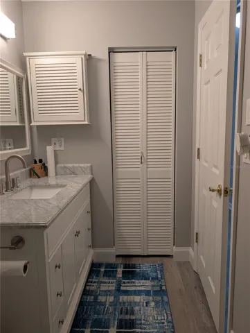 View from shower to linen closet.   Bedroom entrance to right.