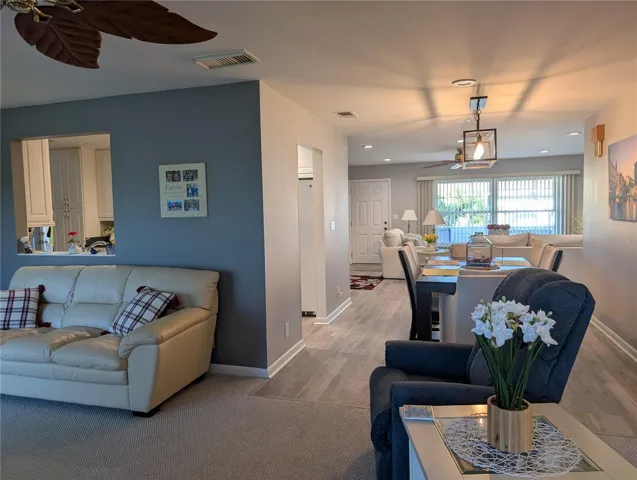 View from Florida room thru dining room to living room and front entry.  Kitchen to left. Pride of ownership is evident throughout this home.