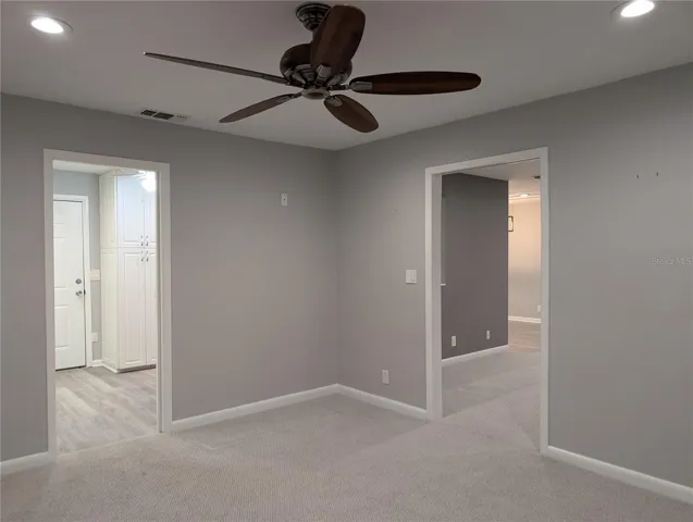 View from bonus room to kitchen laundry area and Florida room.