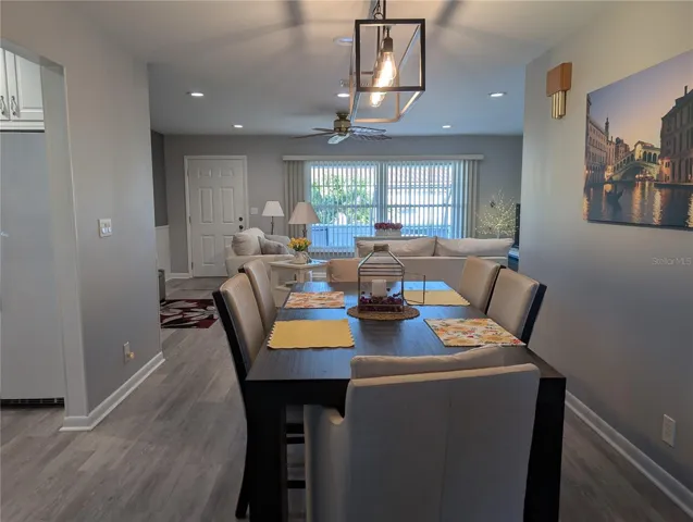 View from dining room thru living room to front entry.