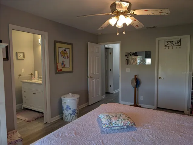 View of Primary Bedroom layout...ensuite bathroom on left, entry to hallway and walk in closet on right.