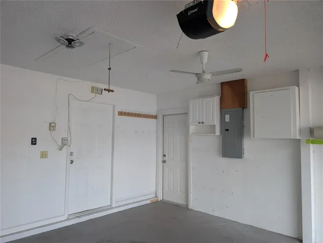 Garage features include updated Eaton Electric Panel, pull down attic access, 6 panel interior access doors to sideyard and kitchen, Linear garage door motor (2019).