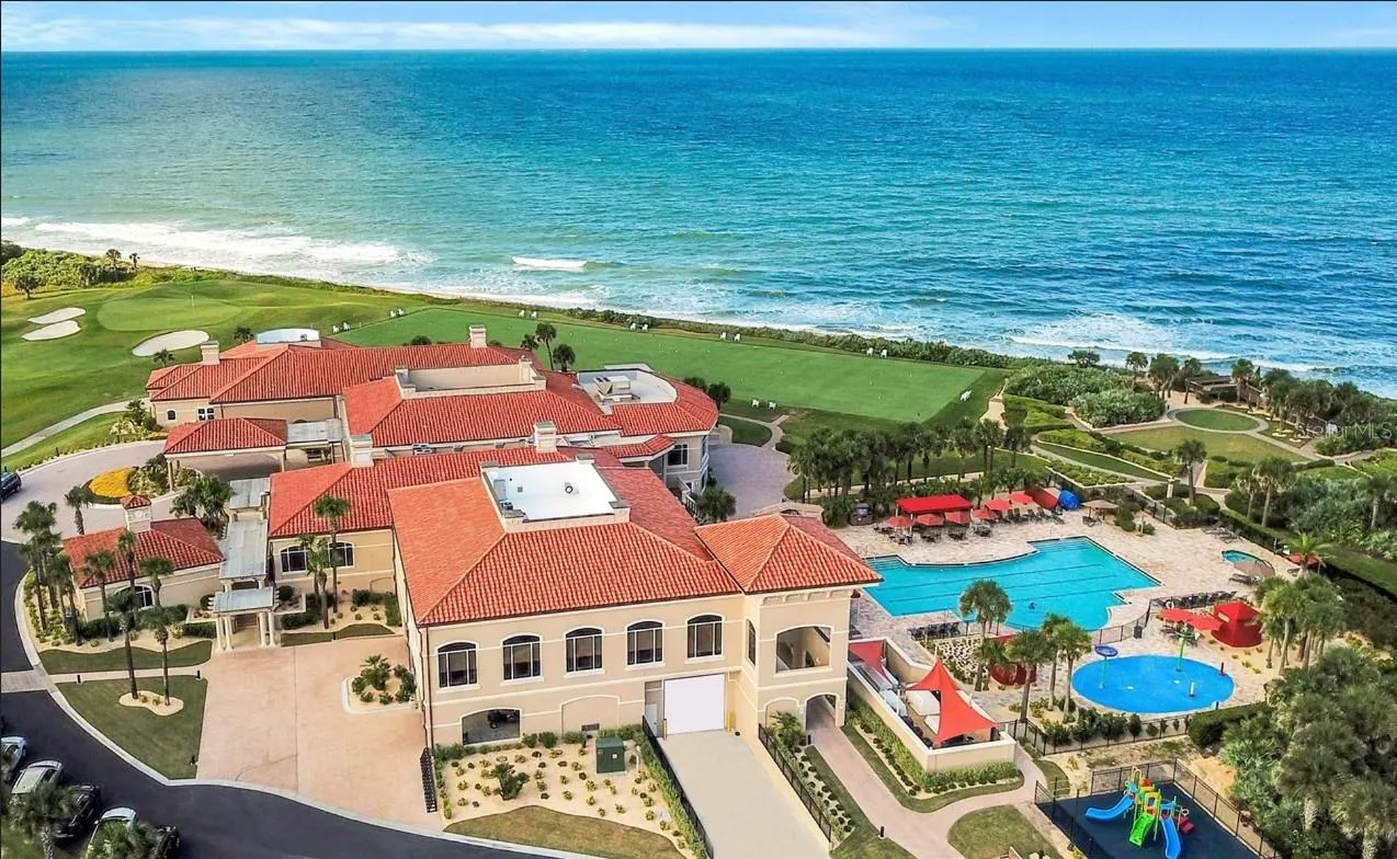 Aerial Side View of CLubhouse, pool and ocean