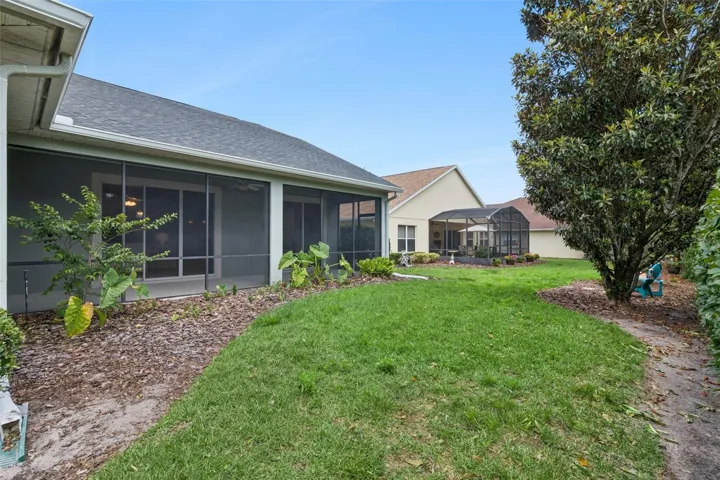 View of the rear of the home & backyard