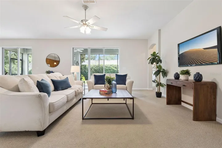 View from Family Room to the screen enclosed covered patio & private backyard