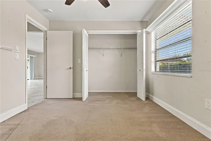 3rd room with doors leading to patio