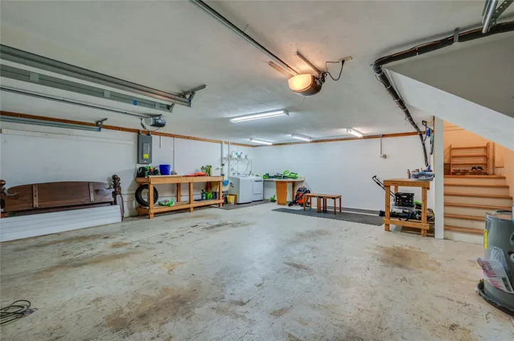 Washer, dryer and laundry sink in garage