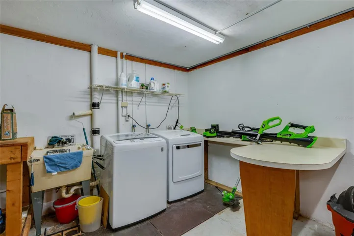 Washer, dryer and laundry sink in garage