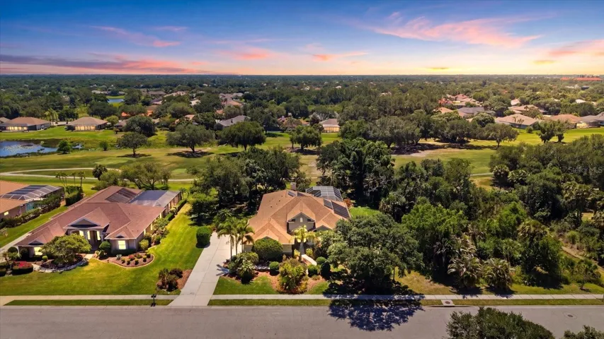 A rare River Club setting with preserve views on one side, backyard fairway views, and beautiful sunsets from your front porch.