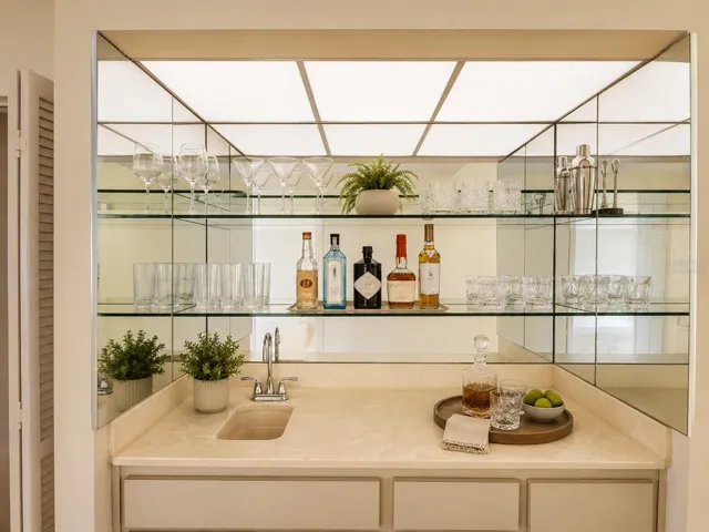 Virtually staged. Built-in wet bar entertaining area with sink. OM724494