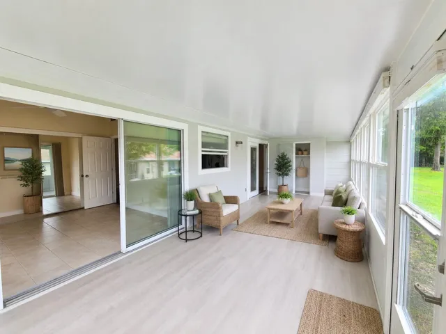 Virtually staged. Covered Florida Room outdoor living area. OM724494