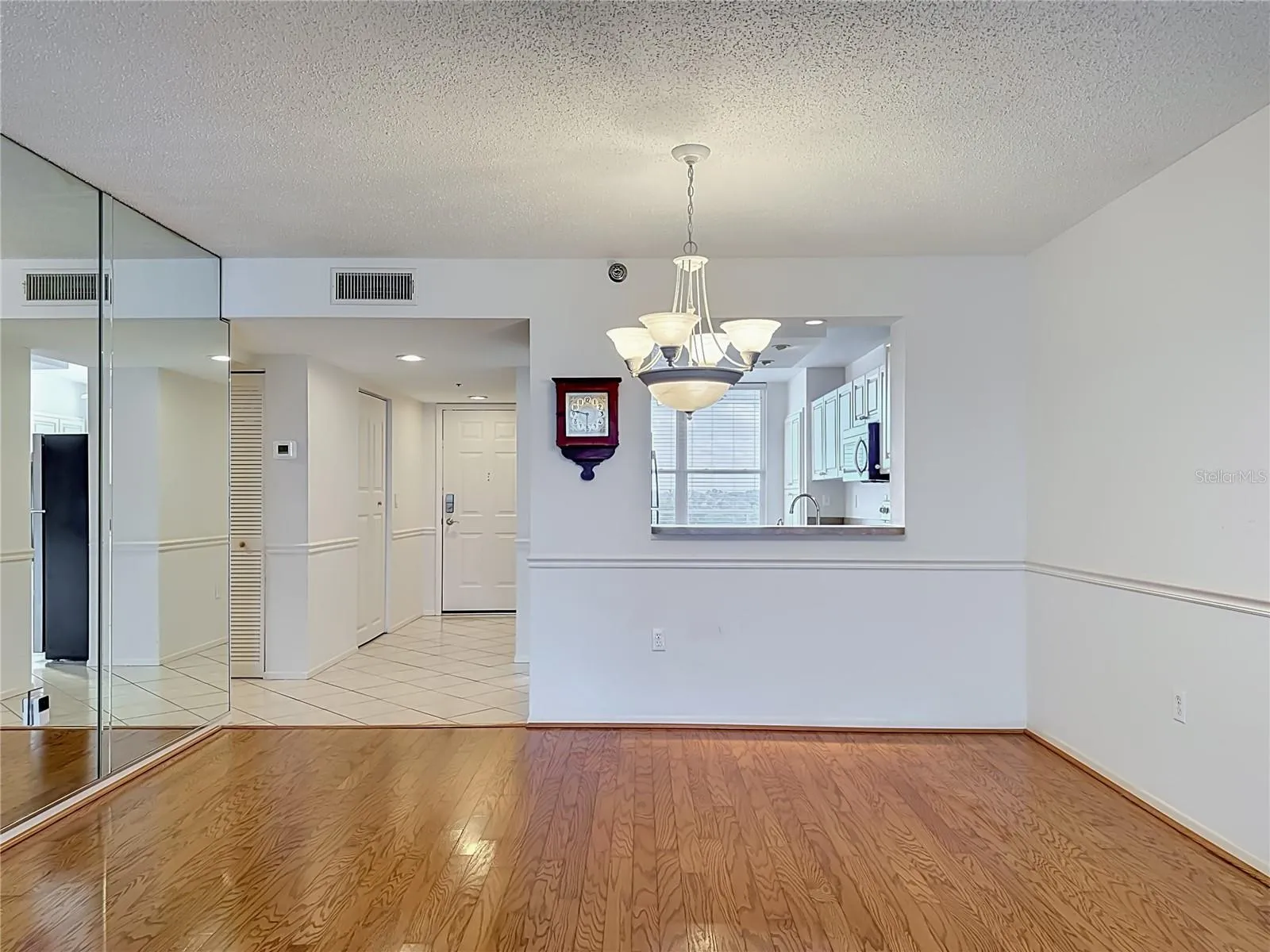 Dining room with pass-through to kitchen.