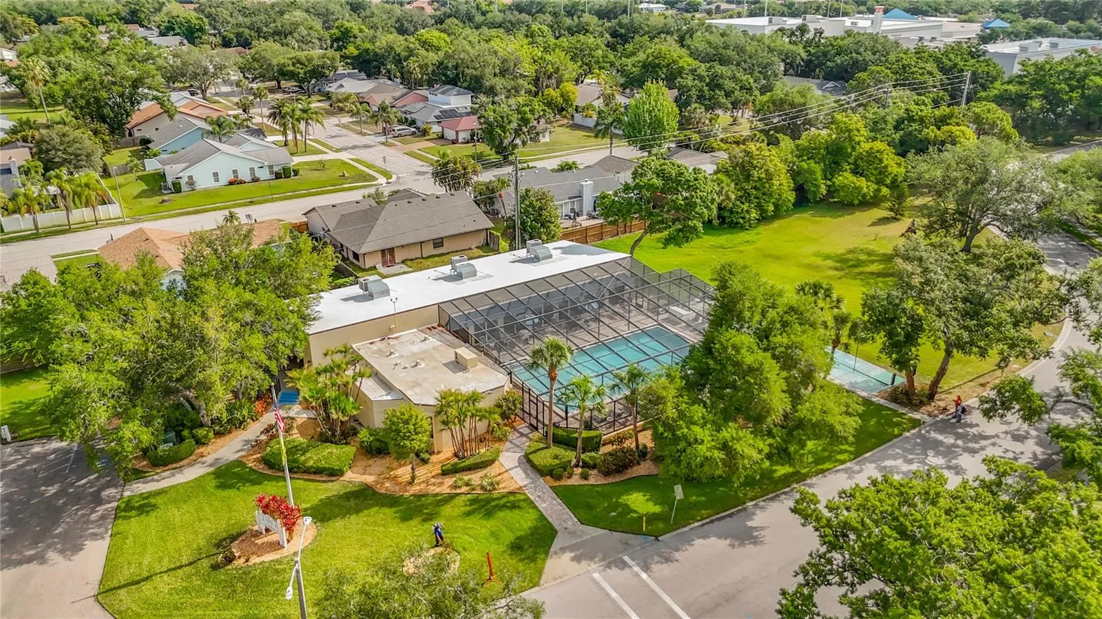 Located directly across from Building 18/3740.  Woods at Pinebrook clubhouse and screen enclosed pool.