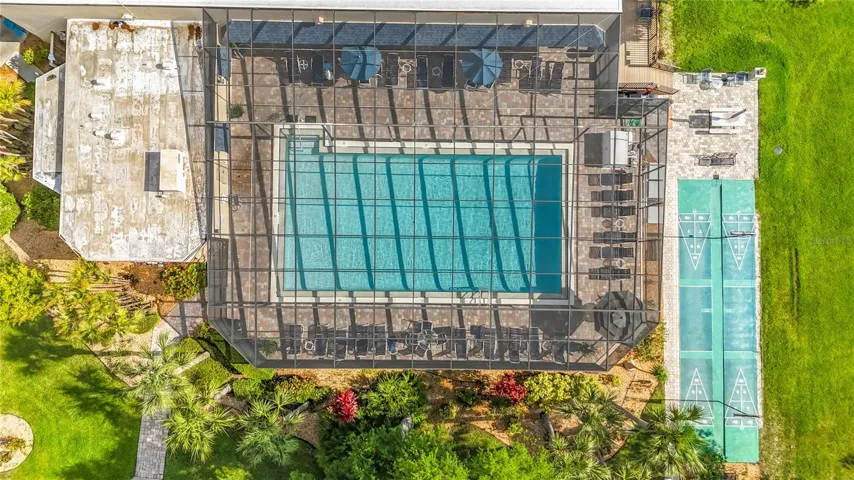 Screen enclosed pool and shuffleboard courts.
