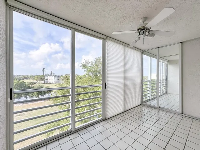 Florida room/glass-enclosed lanai for living room area and another enclosed lanai for the primary suite.