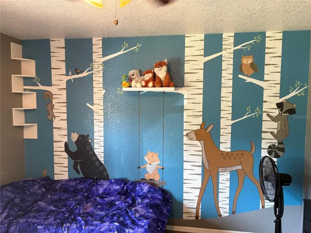 BEDROOM THREE VIEW OF MURAL PAINTED ON THE WALL FROM BEDROOM DOOR