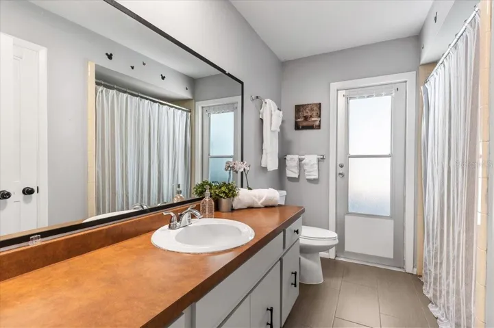 Bathroom 3. Guest bathroom with access to the pool. Tub/shower combo.  Large storage closet in the bathroom.