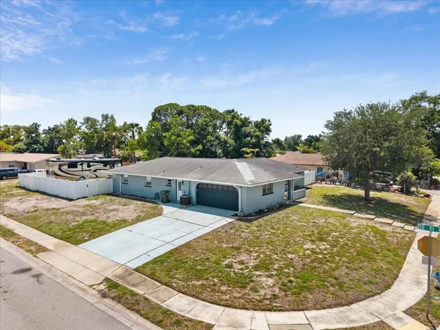 Side load garage. Oversized driveway.