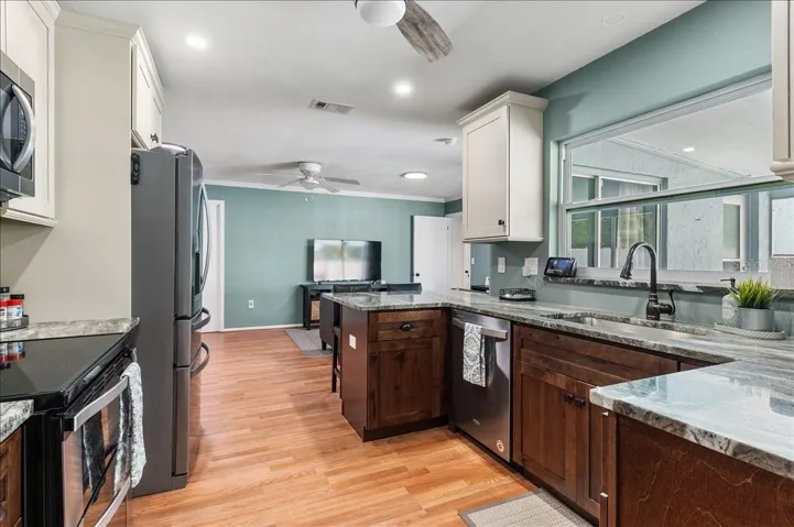 Custom kitchen with view overlooking the pool.  Bar seating at the counter.