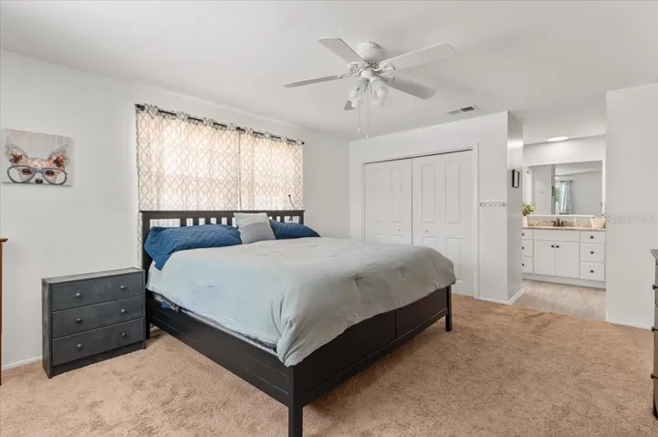 Primary bedroom. Dual closets. Vanity is split from the toilet and shower area.
