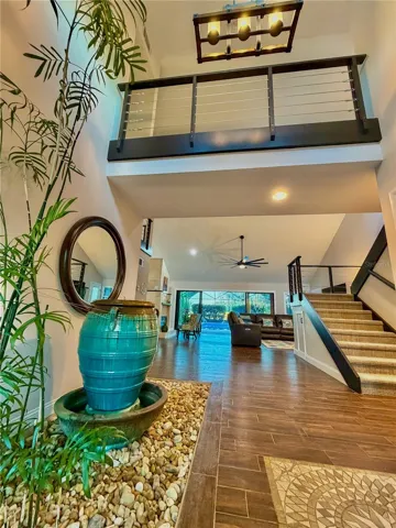 Stunning entry with water fountain and palm