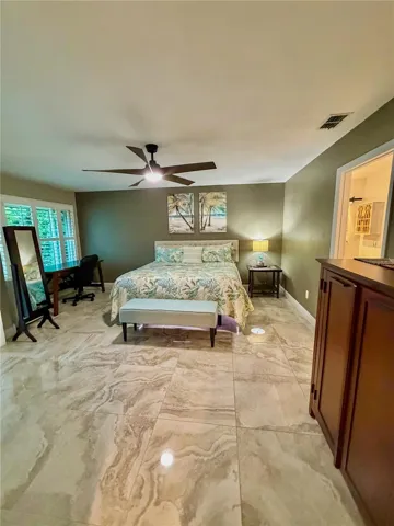 Master bedroom with beautiful tile floors