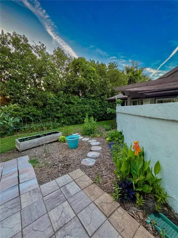 Side yard with flowers and fruit trees