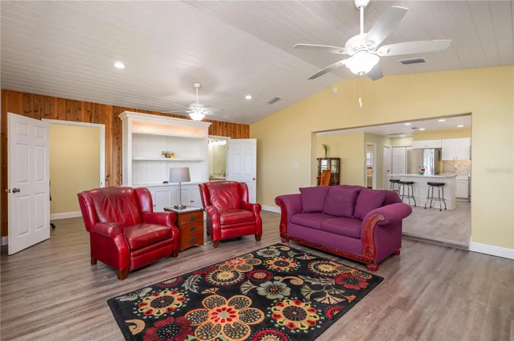 Living room. Chairs are darker than they appear. More of a wine color