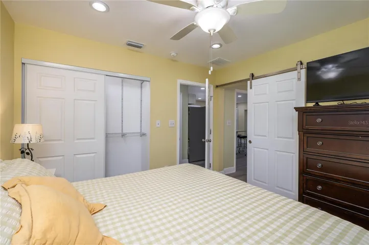 Primary bedroom, barn door to Primary bathroom