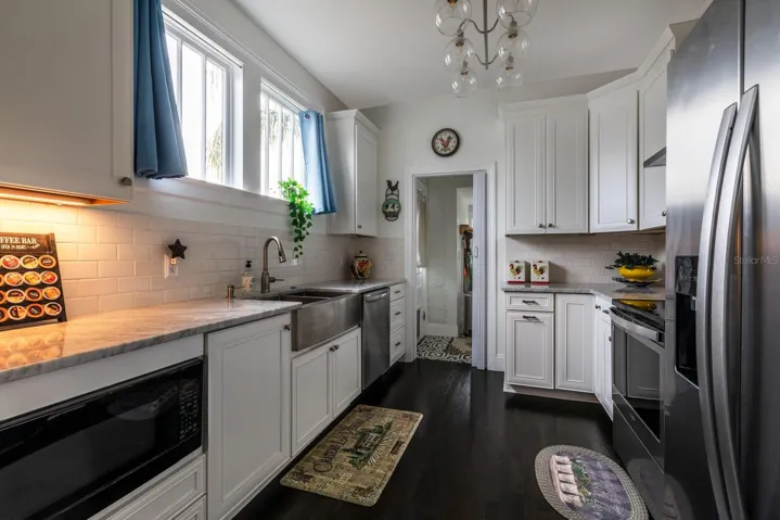 Kitchen into Laundry Room and back exit.
