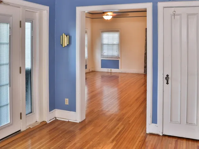 Living room looking towards the family room. Original hardwood floors.