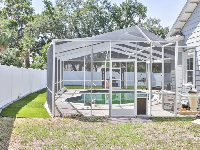 Enclosed gunite swimming pool.
