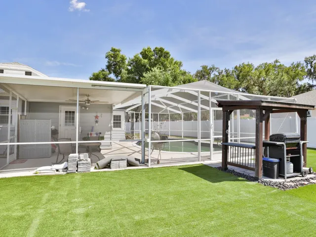 Lania and enclosed pool area and separate cook shed.