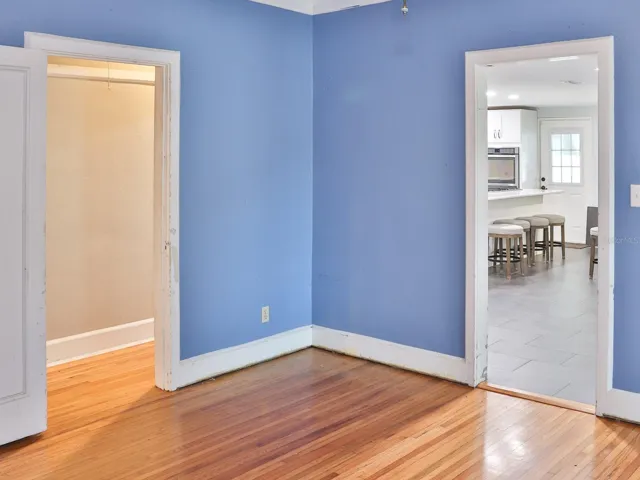 Living room with view of the kitchen.