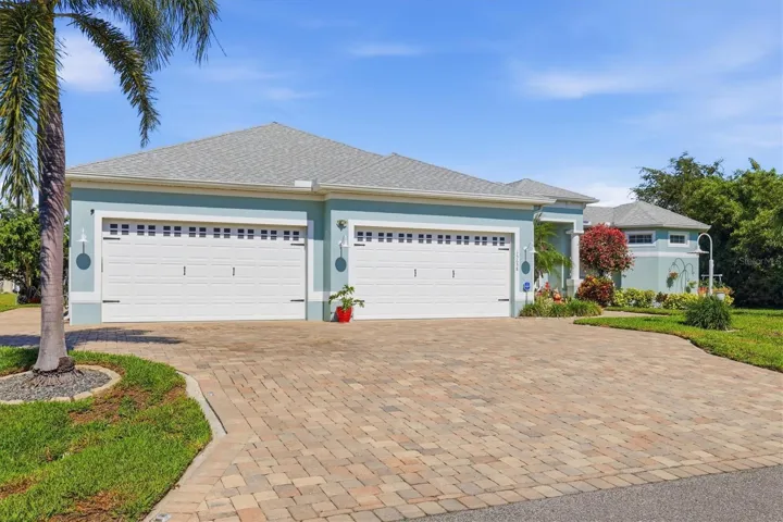 Oversized driveway with paver walkway, pad to the rear of the home