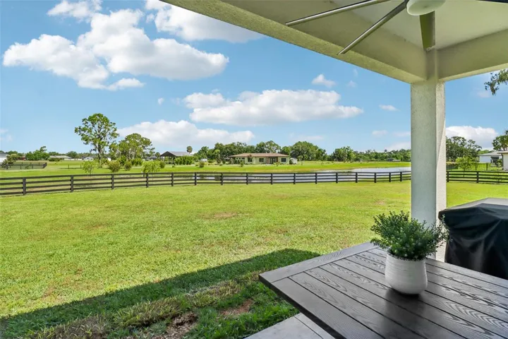Covered lanai with ceiling fan, room to sit, room to grill and those views!!!!