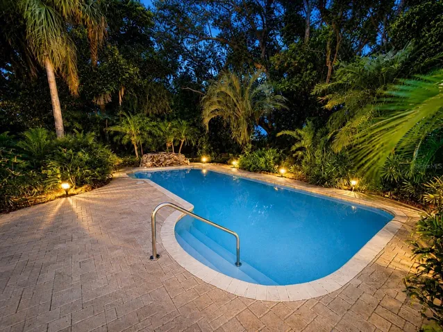 Tropical poolside retreat at twilight