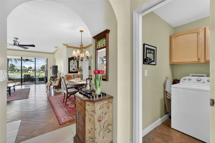 Foyer to living/dining; laundry and garage to the right