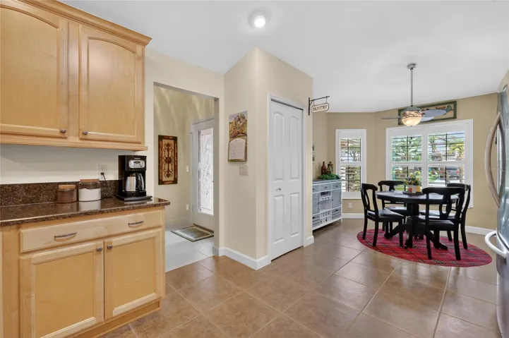 Foyer, closet pantry, dinette. Note all the Plantation shutters