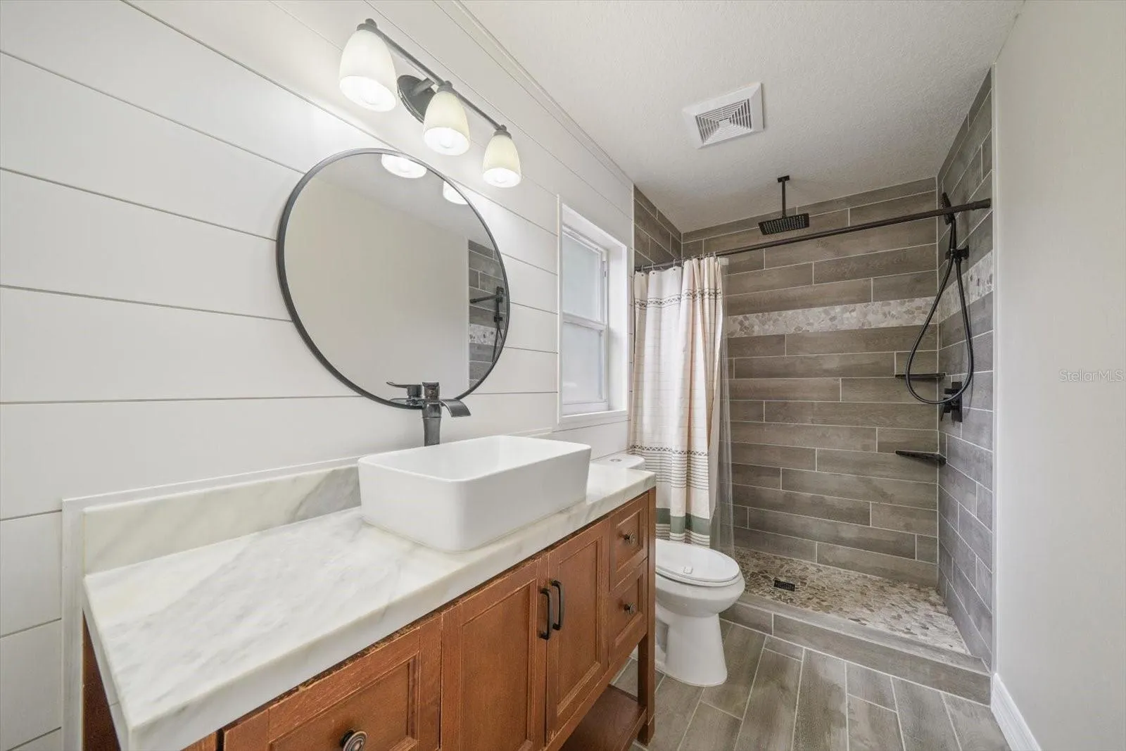 Primary bathroom - All new shiplap and new paint - walk-in shower no tub with rainfall shower