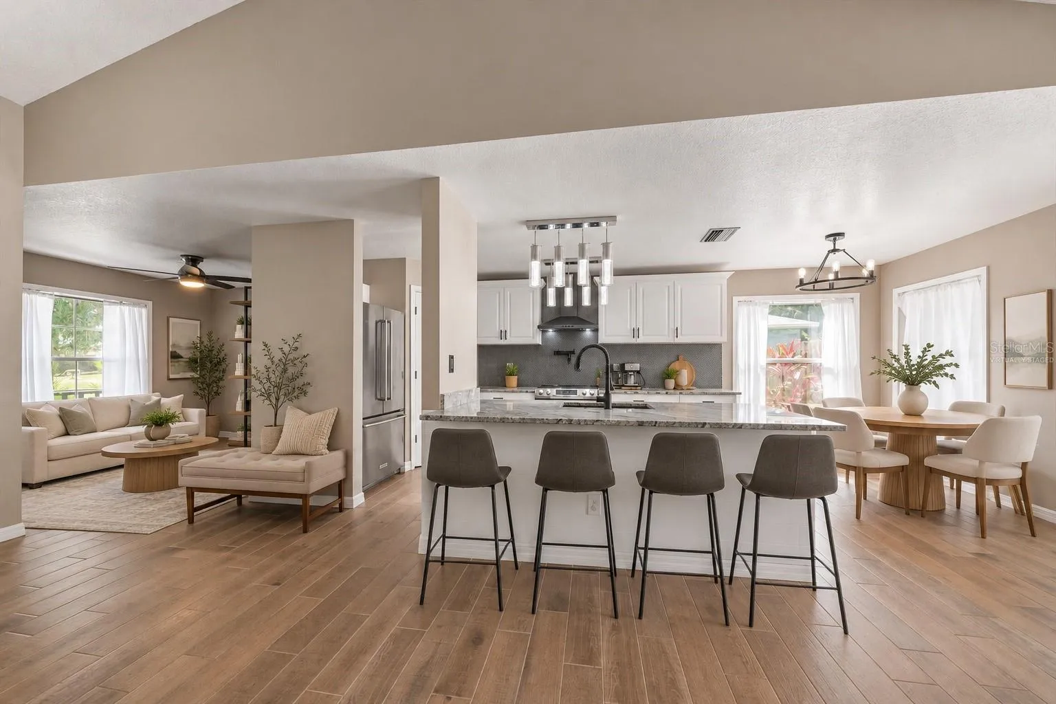 Virtually staged kitchen with breakfast bar seating
