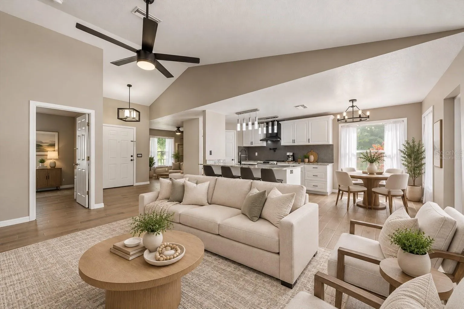 Virtually staged living room, kitchen, dining room